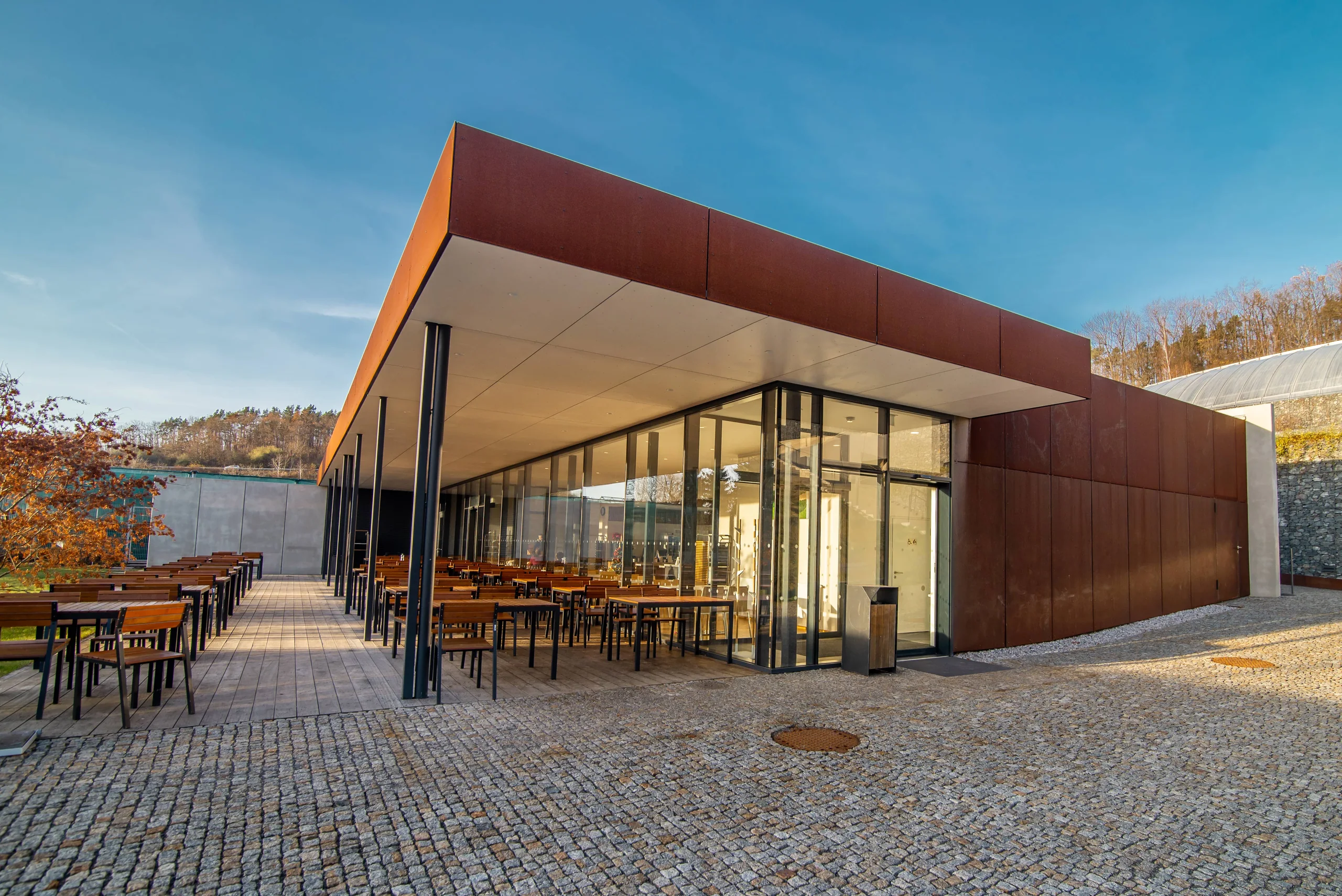 Modern building with brown façade cladding by DOPOS HK